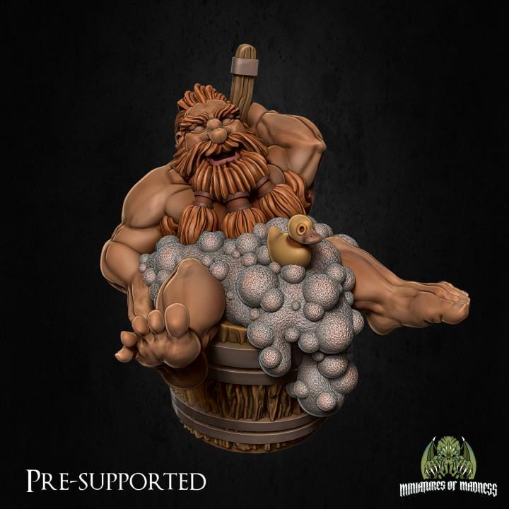 a statue of a man with a beard sitting in a basket of balls