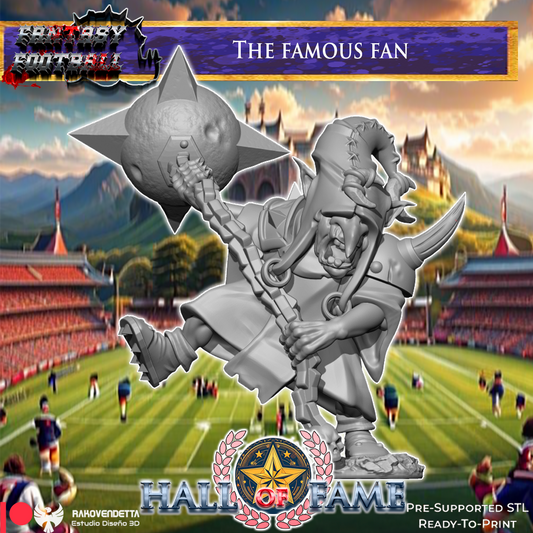The image is a promotional poster for a fantasy football game called "The Famous Fan". It features a large statue of a fan holding a trophy, set against a backdrop of a football stadium and a castle. The text "FANTASY FOOTBALL" and "The Famous Fan" are prominently displayed, along with the game's title and the company's name, "RAHLEFREITZ Estuario Desejos 3D".