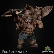 a statue of a man with an owl on his shoulder