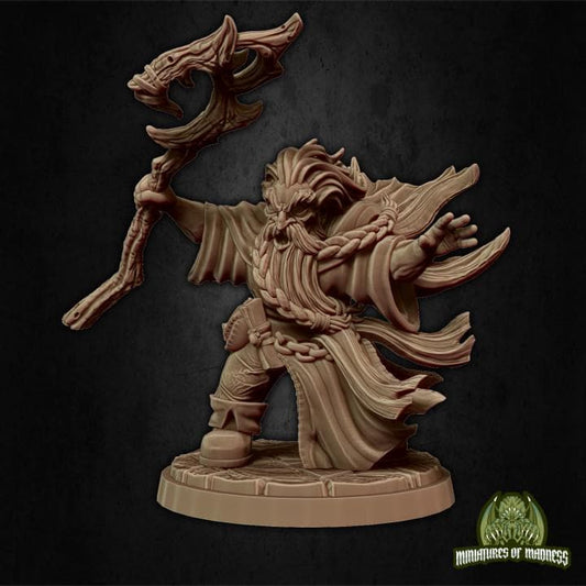 a statue of a demon holding a staff
